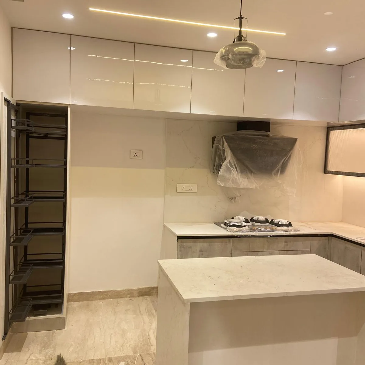 Aditya Empress apartment interiors in Hyderabad by AlcorOne Solutions — Modular kitchen & tall units