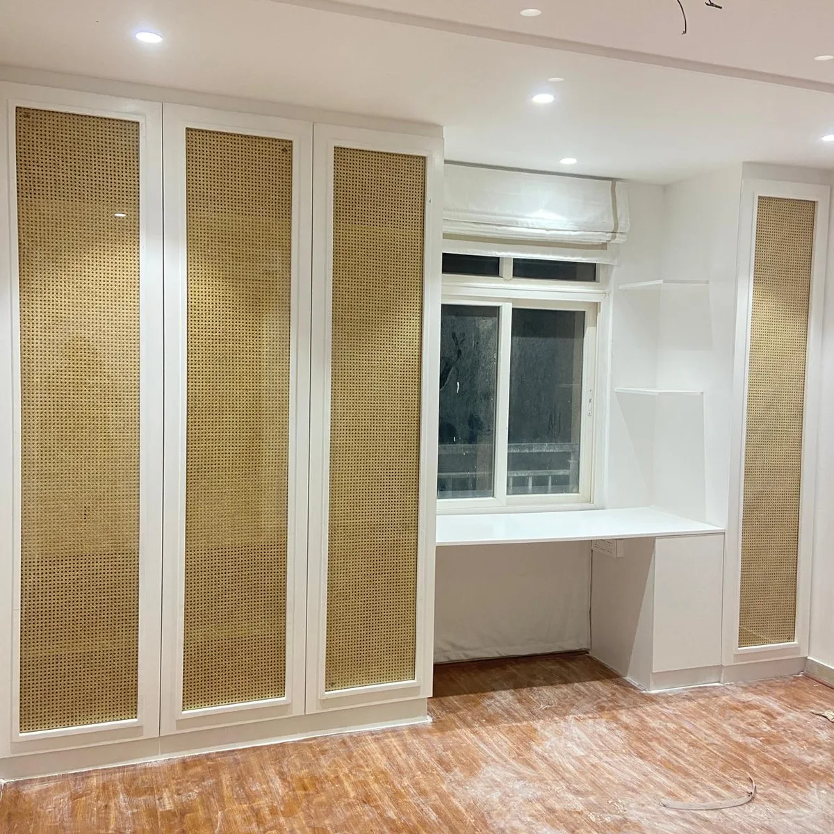 Aditya Empress apartment interiors in Hyderabad by AlcorOne Solutions — Cane-panel wardrobe & study desk