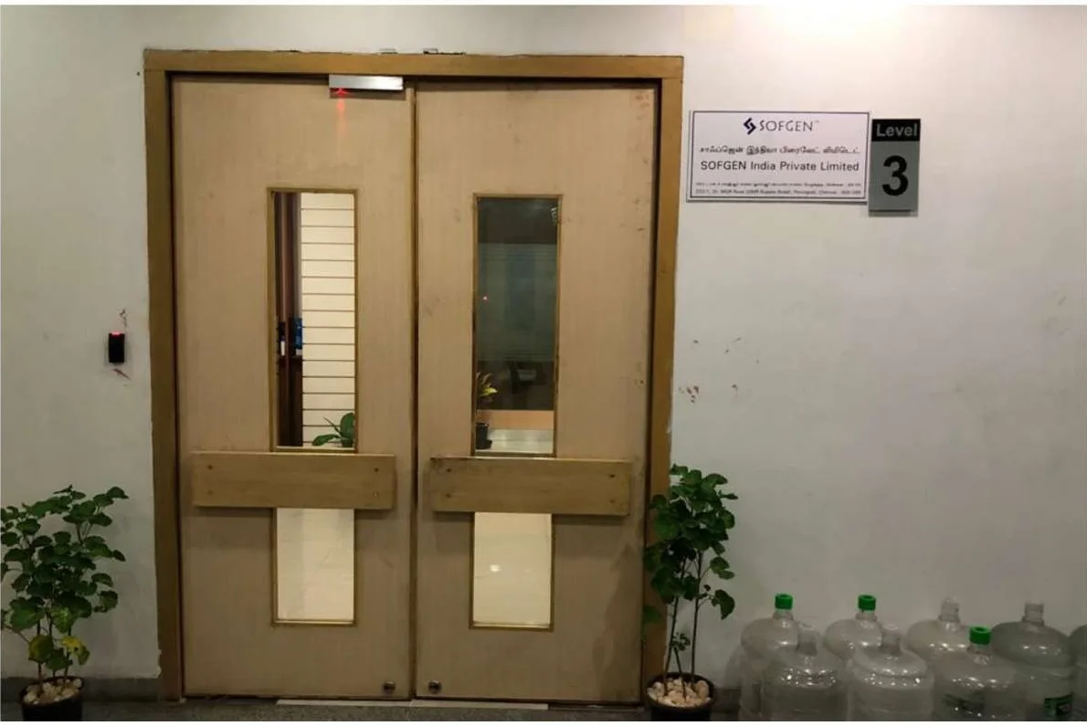 KG360 office fit-out Chennai by AlcorOne Solutions — branded entrance door and signage