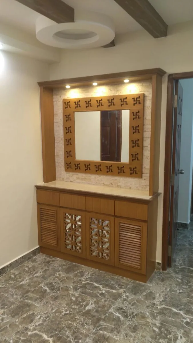 Ozone home interiors in Chennai by AlcorOne Solutions — Mirror console with jaali cabinet