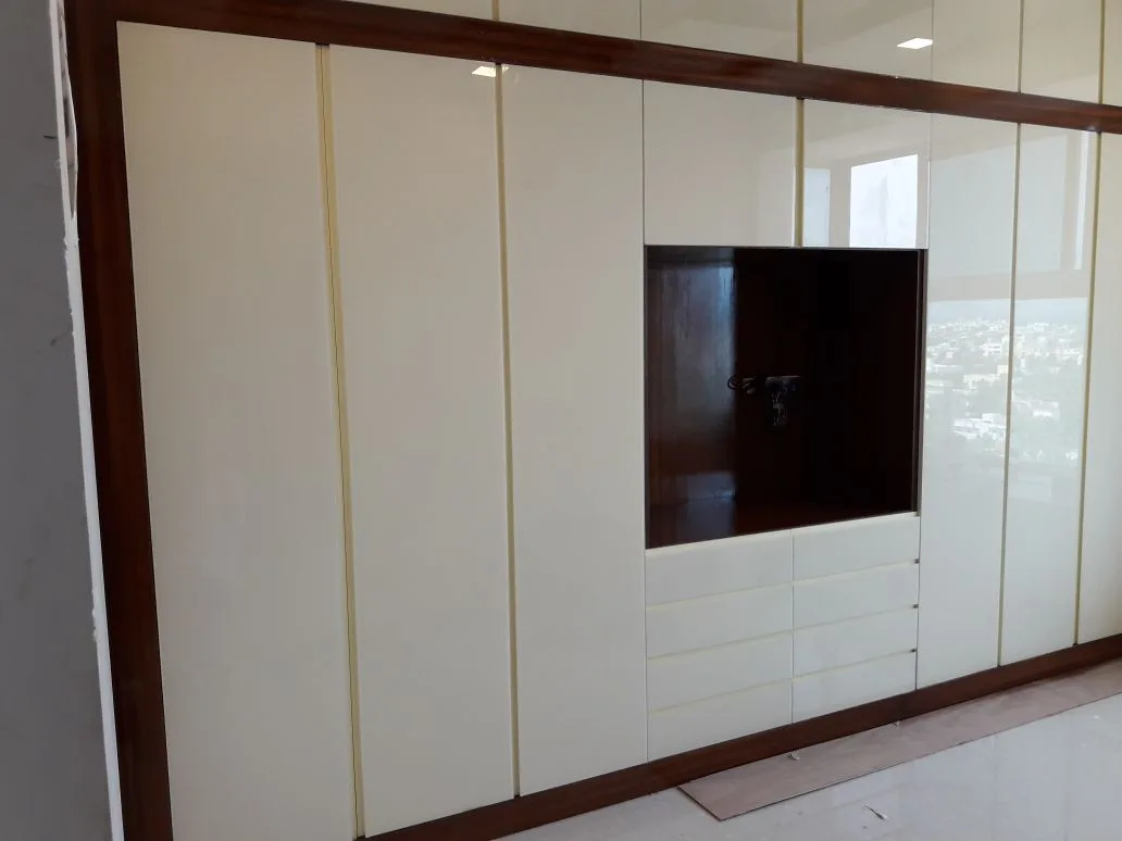 Ozone home interiors in Chennai by AlcorOne Solutions — Wardrobe & TV unit