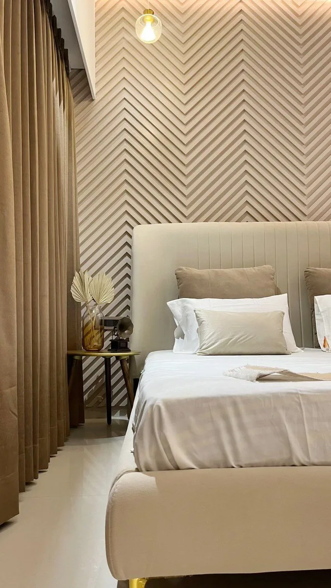 Serene 3BHK Residence interior in Hyderabad by AlcorOne Solutions — Bedroom with herringbone panelling