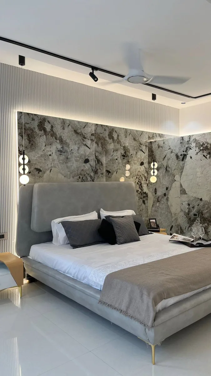Serene 3BHK Residence interior in Hyderabad by AlcorOne Solutions — Bedroom with stone-look feature wall