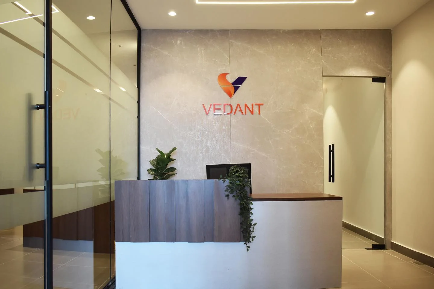 Vedant Petrochem office fit-out Hyderabad by AlcorOne Solutions — marble reception with brand signage