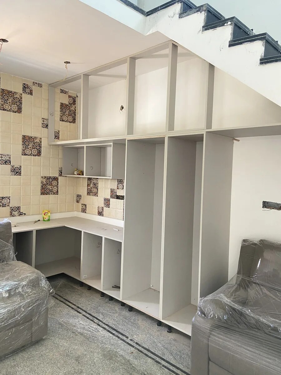Under-stair storage and study unit during installation, villa in Bengaluru