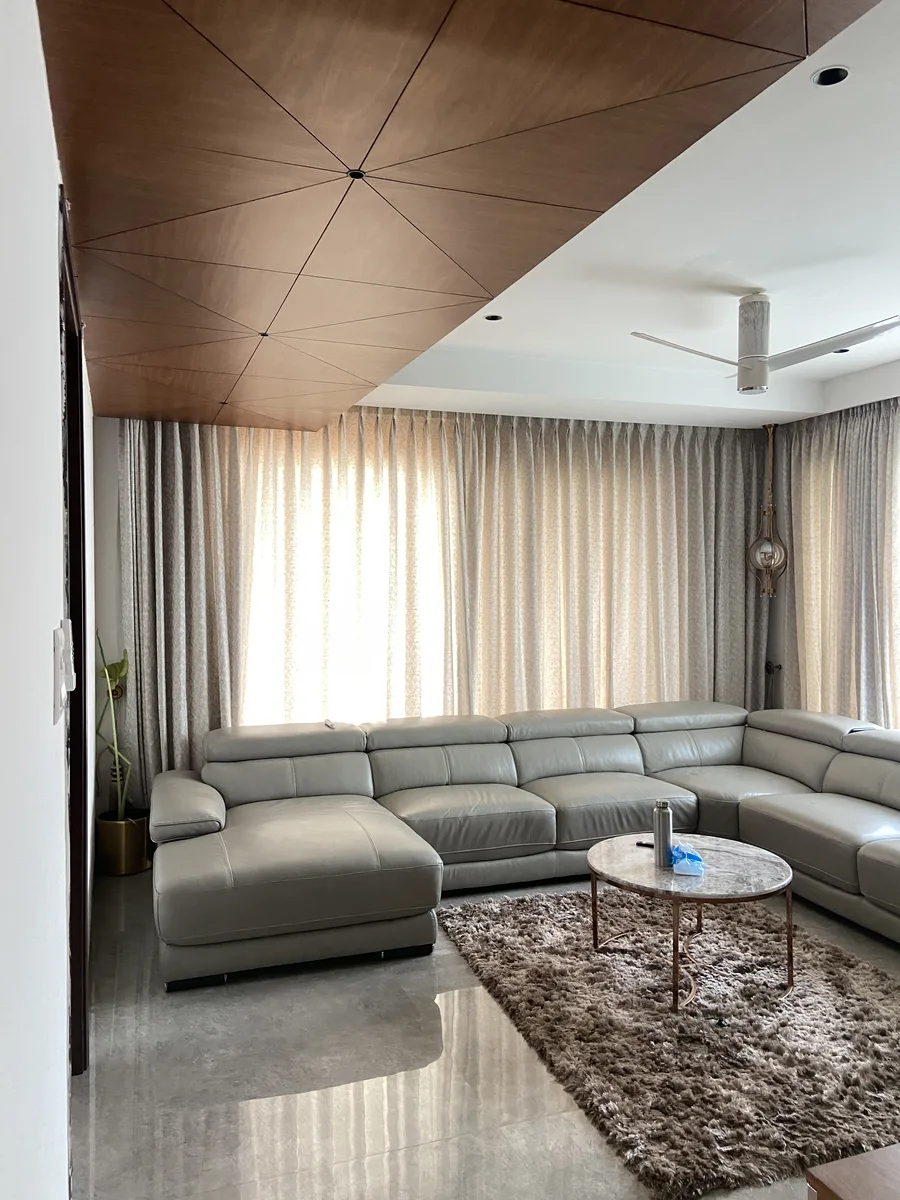Villa interior in Hyderabad by AlcorOne Solutions — Living room & veneer ceiling