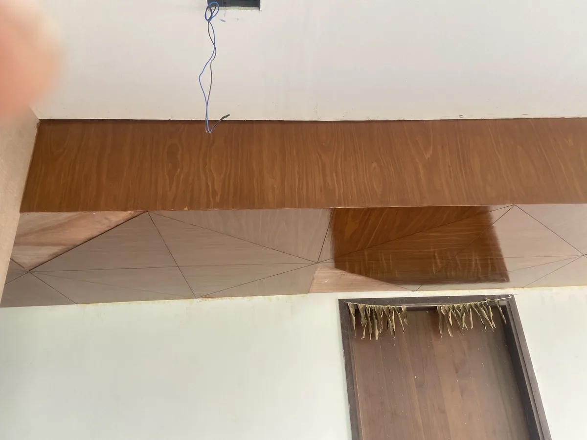 Villa interior in Hyderabad by AlcorOne Solutions — Veneer ceiling during installation